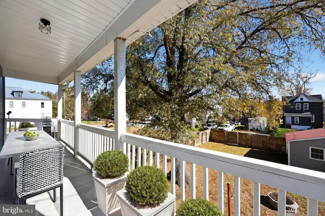 a view of a chairs and tables in the balcony