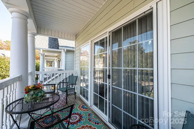 a view of a balcony and chairs