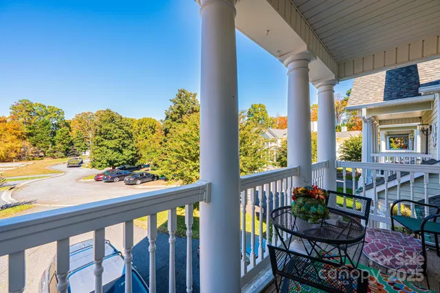 a view of balcony with furniture