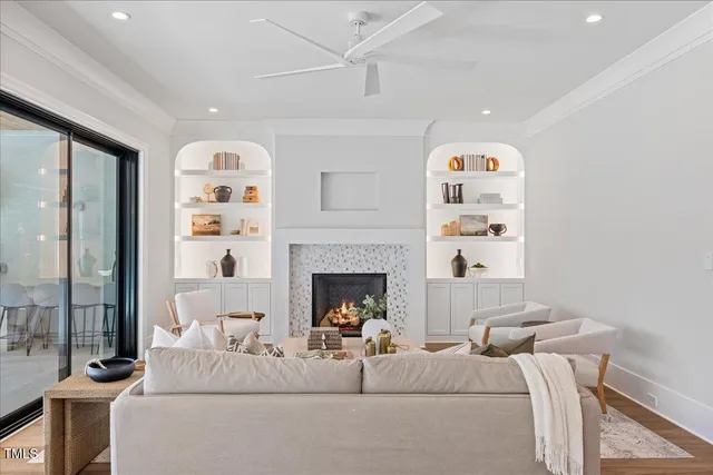 a living room with couch and a floor to ceiling window