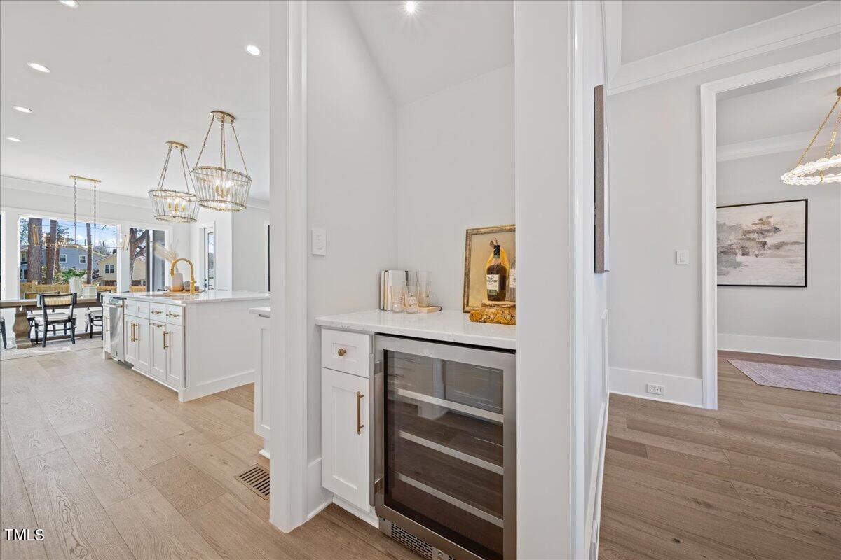 4906 Tremont Drive Raleigh, NC 27609 - Photo 18 of 71 a view of kitchen and wooden floor