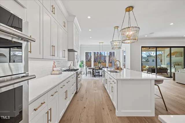 a bathroom with a granite countertop toilet a sink and a mirror
