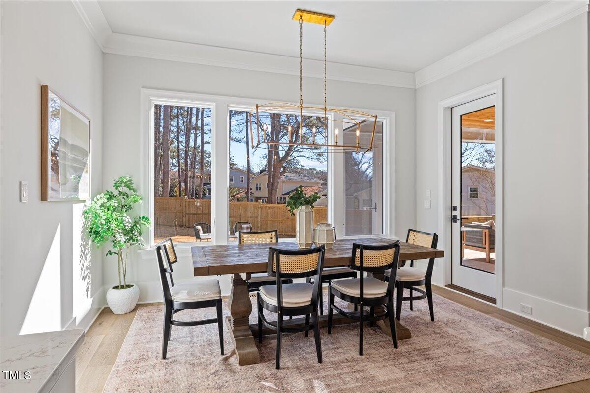 4906 Tremont Drive Raleigh, NC 27609 - Photo 21 of 71 a view of a dining room with furniture window and outside view