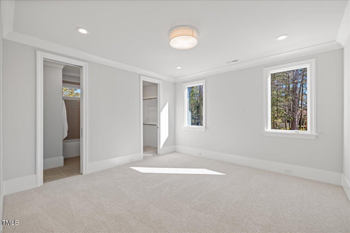 4906 Tremont Drive Raleigh, NC 27609 - Photo 35 of 71 an empty room with windows and closet