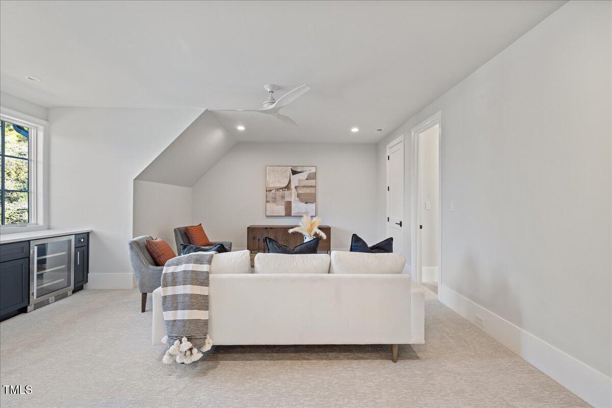 4906 Tremont Drive Raleigh, NC 27609 - Photo 37 of 71 a living room with furniture and a window