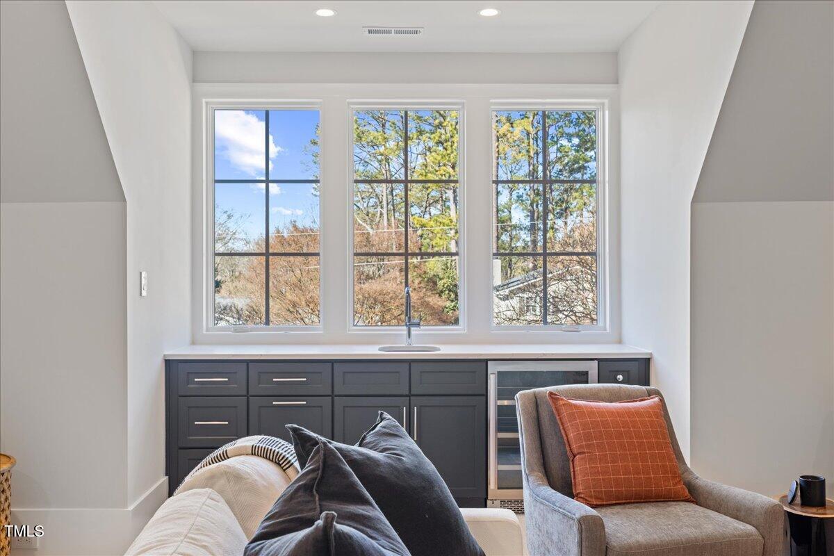 4906 Tremont Drive Raleigh, NC 27609 - Photo 38 of 71 a view of a livingroom with furniture and windows