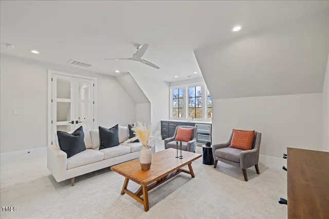 a view of a hallway with wooden floor and entryway