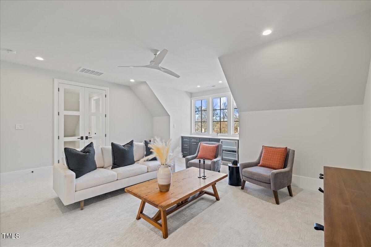 4906 Tremont Drive Raleigh, NC 27609 - Photo 39 of 71 a living room with furniture and a window