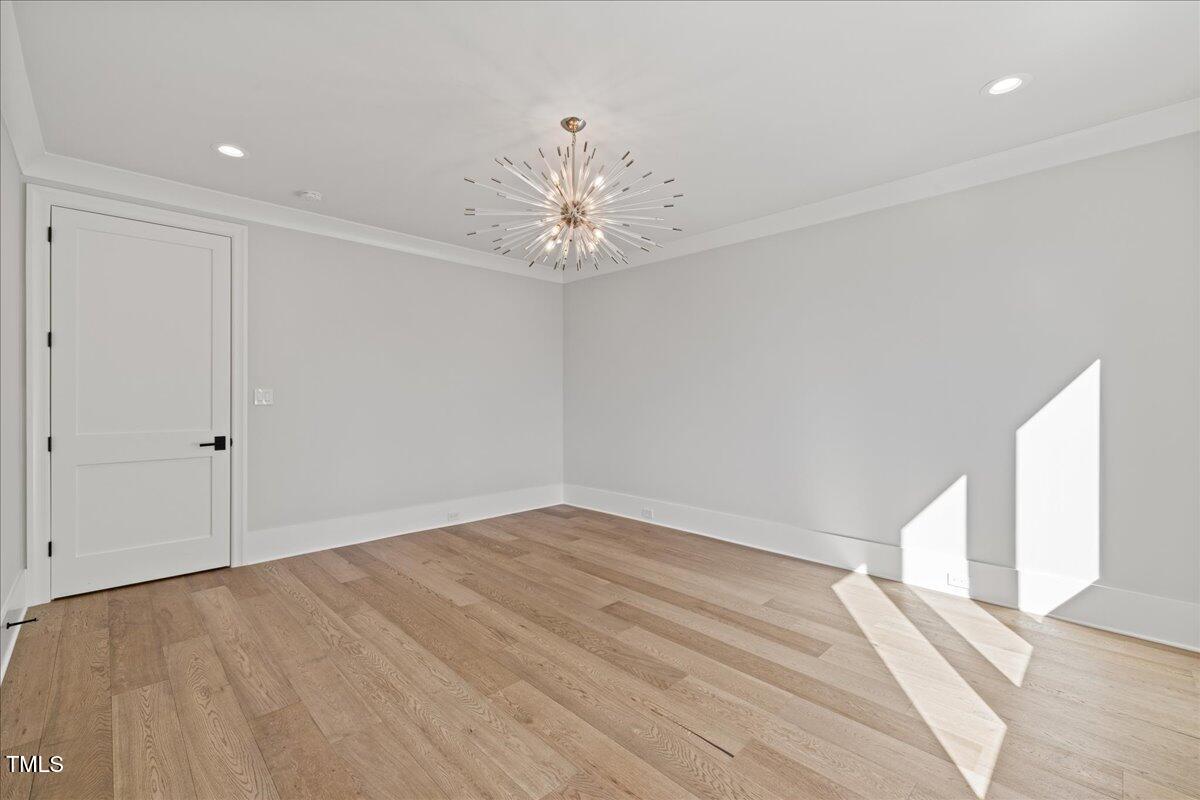 4906 Tremont Drive Raleigh, NC 27609 - Photo 46 of 71 wooden floor in an empty room with a window