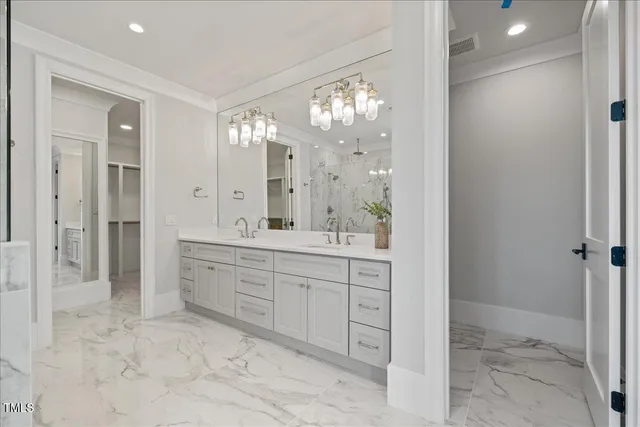 a view of a house with swimming pool and sitting area