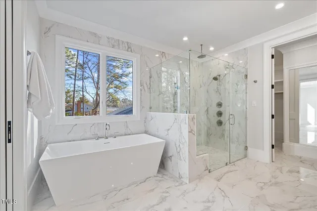 a view of a house with swimming pool and sitting area