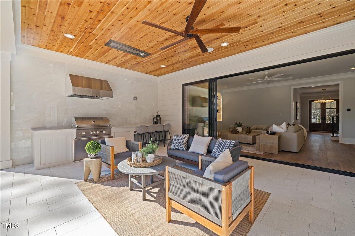 4906 Tremont Drive Raleigh, NC 27609 - Photo 63 of 71 a living room with furniture and a wooden floor