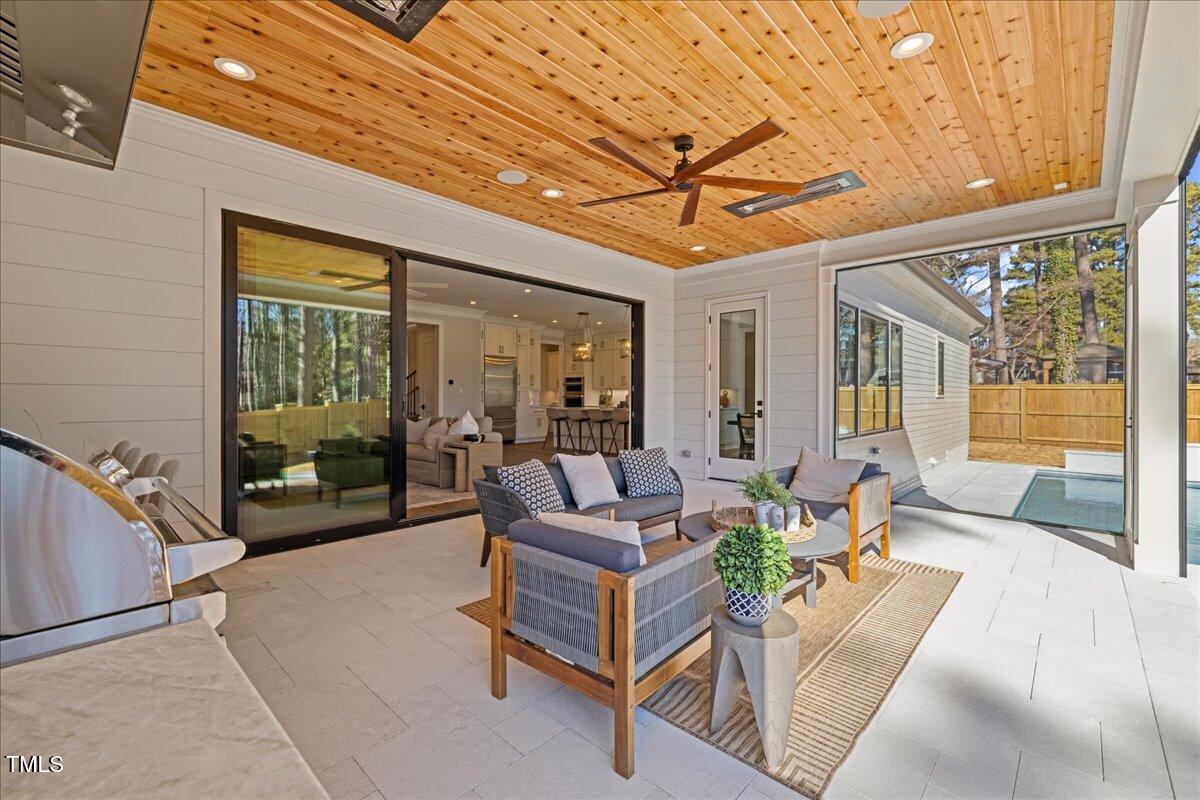 4906 Tremont Drive Raleigh, NC 27609 - Photo 64 of 71 a living room with furniture and a large window