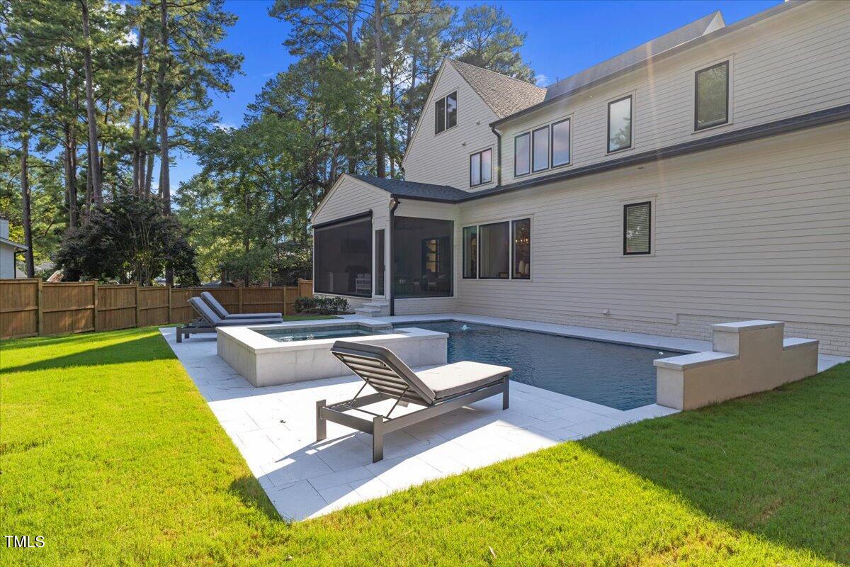 4906 Tremont Drive Raleigh, NC 27609 - Photo 67 of 71 a view of a house with swimming pool and sitting area