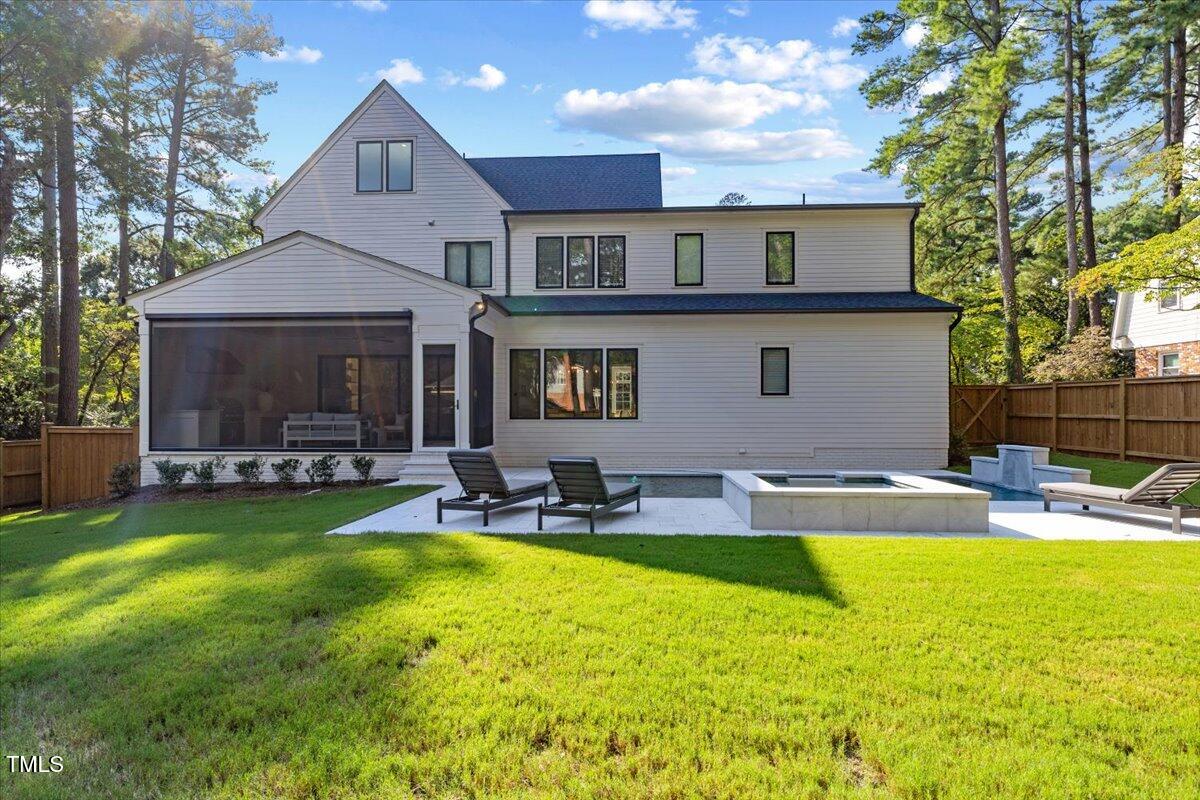 4906 Tremont Drive Raleigh, NC 27609 - Photo 68 of 71 a view of a house with swimming pool and sitting area