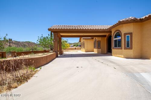 480 Camino Ramanote Rio Rico, AZ 85648 - Photo 3 of 43 Drive up concrete circular driveway to the convenient covered front door entry.