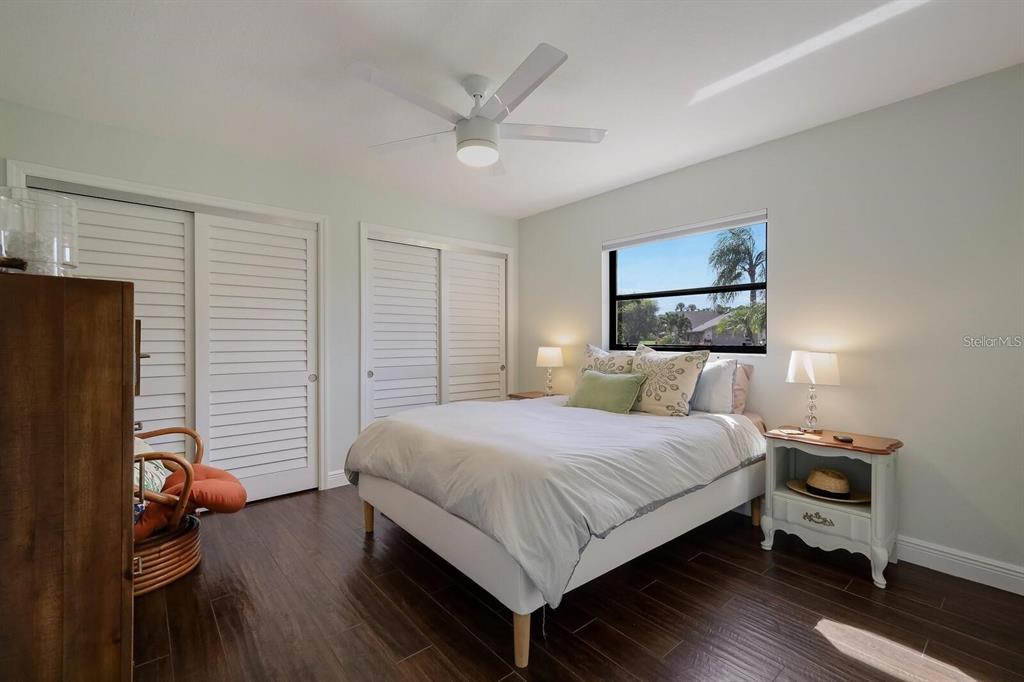 3705 Torrey Pines Boulevard Sarasota, FL 34238 - Photo 21 of 30 a bedroom with a bed and a flat screen tv