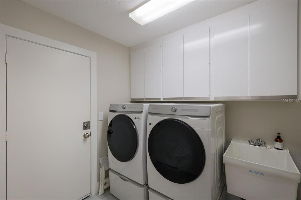 3705 Torrey Pines Boulevard Sarasota, FL 34238 - Photo 26 of 30 a utility room with dryer and washer