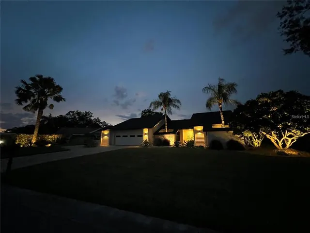 a view of a backyard of a house with a garden
