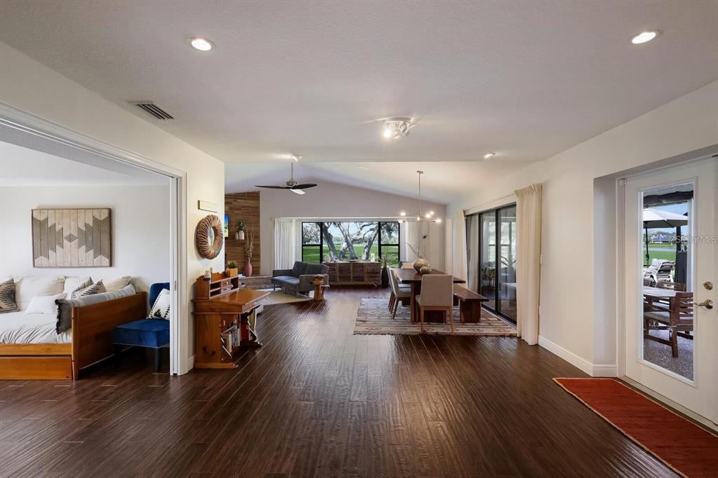3705 Torrey Pines Boulevard Sarasota, FL 34238 - Photo 4 of 30 a living room with furniture and wooden floor