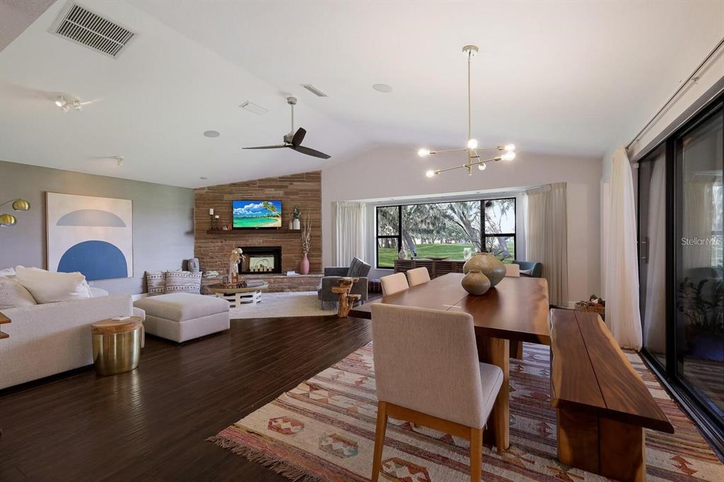 3705 Torrey Pines Boulevard Sarasota, FL 34238 - Photo 5 of 30 a living room with fireplace furniture and a flat screen tv