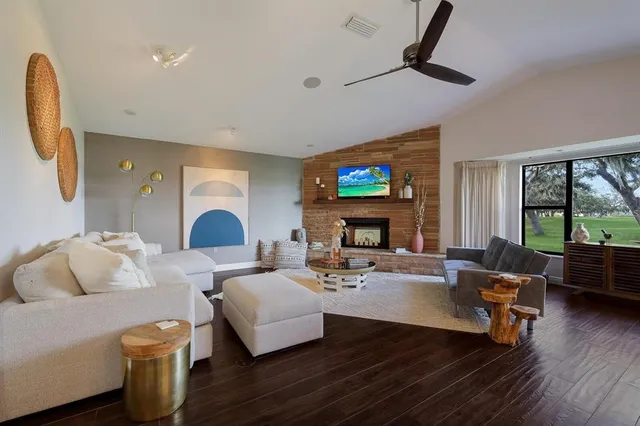 a living room with furniture and a fireplace