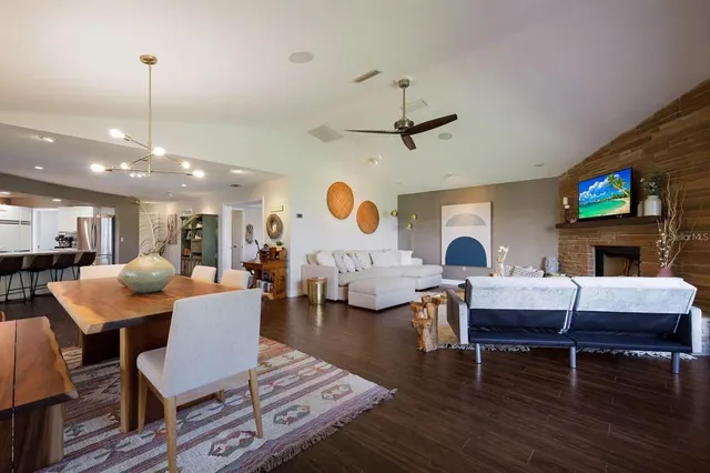a living room with fireplace furniture and a flat screen tv