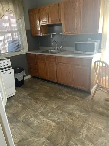 a kitchen with a sink and a stove