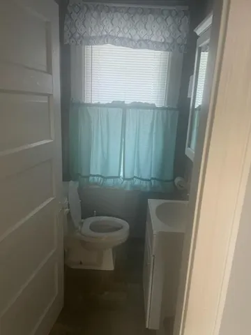 a bathroom with a toilet and a sink