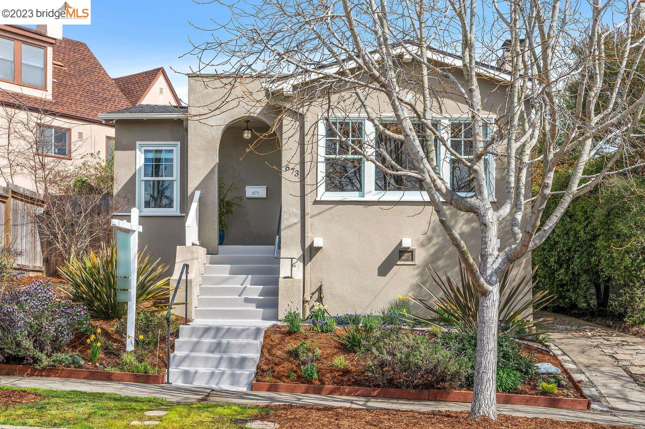 a front view of a house with garden