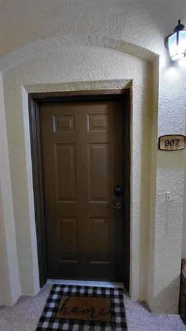 a kitchen with stainless steel appliances granite countertop a sink and a refrigerator