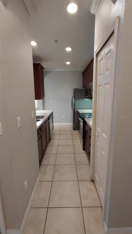 a kitchen with a sink cabinets and stainless steel appliances
