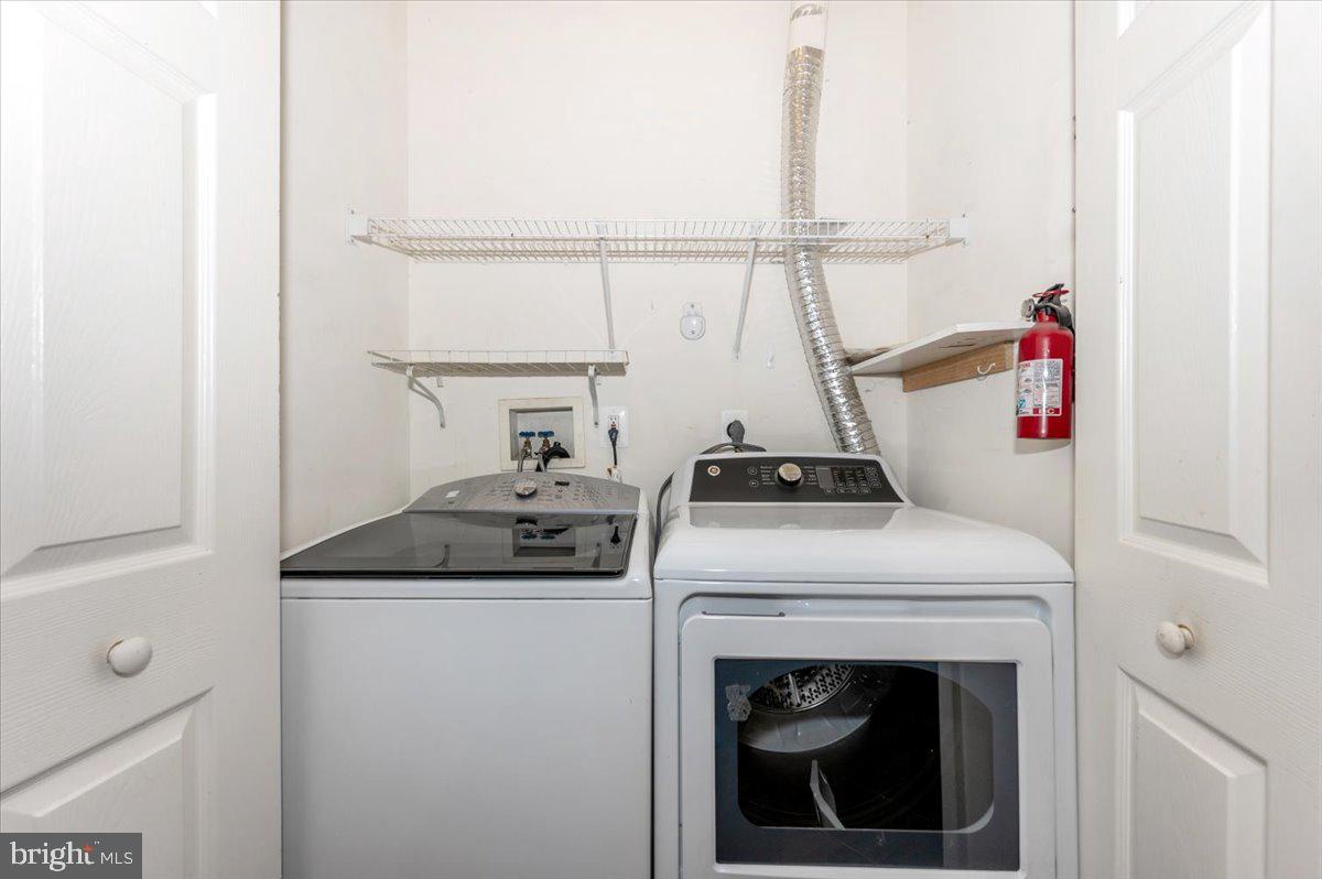 1683 Fallowfield Court Crofton, MD 21114 - Photo 10 of 28 a utility room with dryer and washer