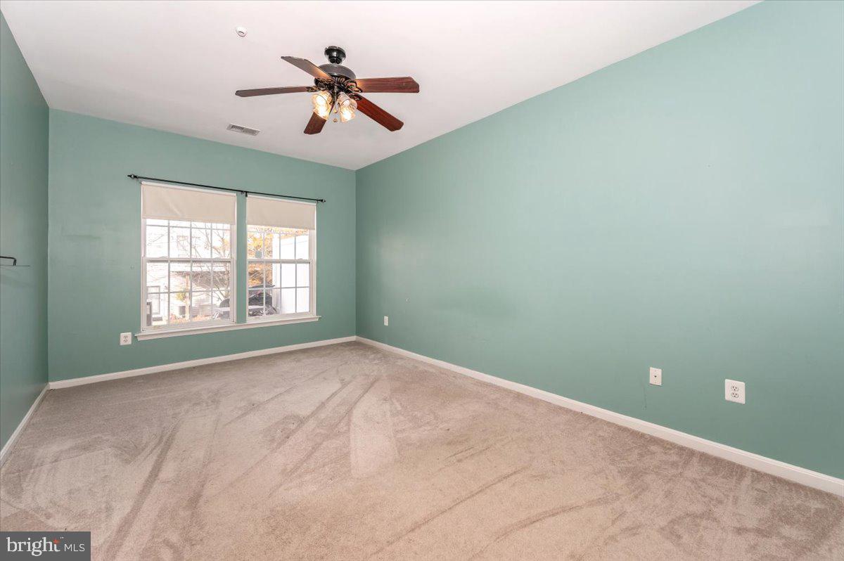 1683 Fallowfield Court Crofton, MD 21114 - Photo 12 of 28 a view of a room with windows and ceiling fan