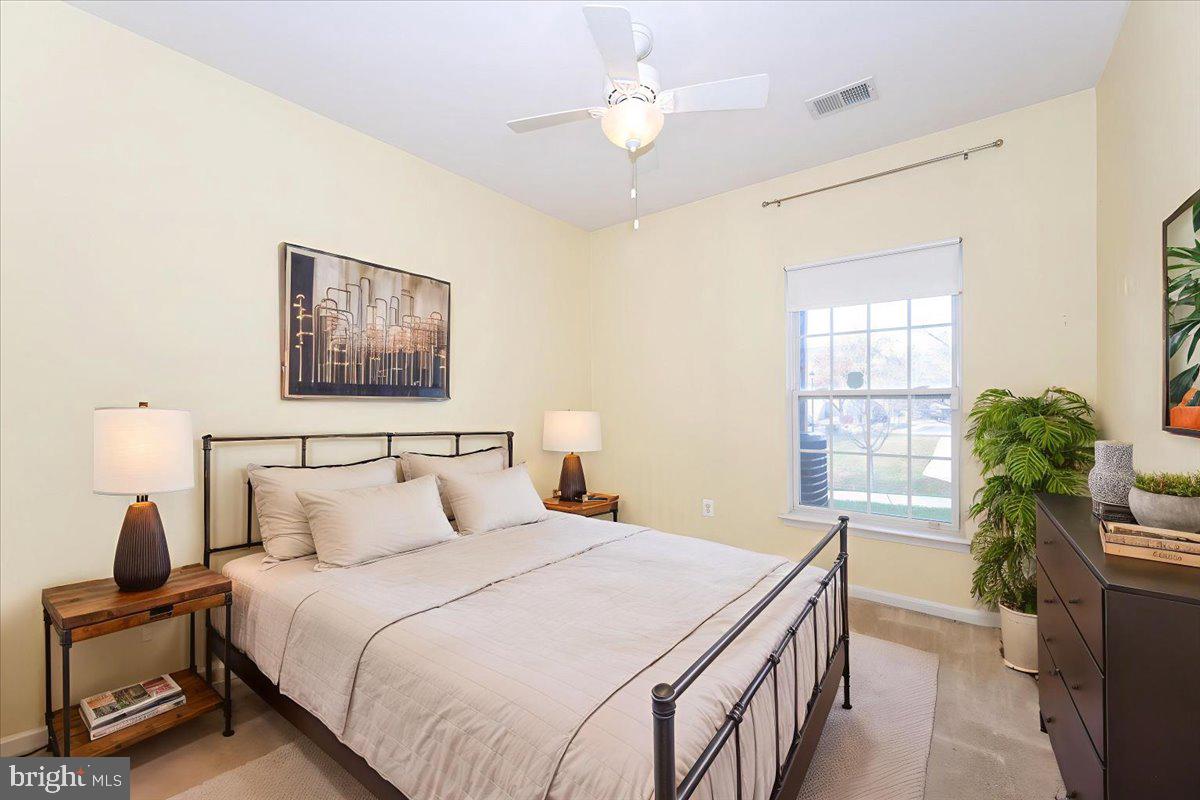 1683 Fallowfield Court Crofton, MD 21114 - Photo 20 of 28 a bedroom with a bed and a chandelier