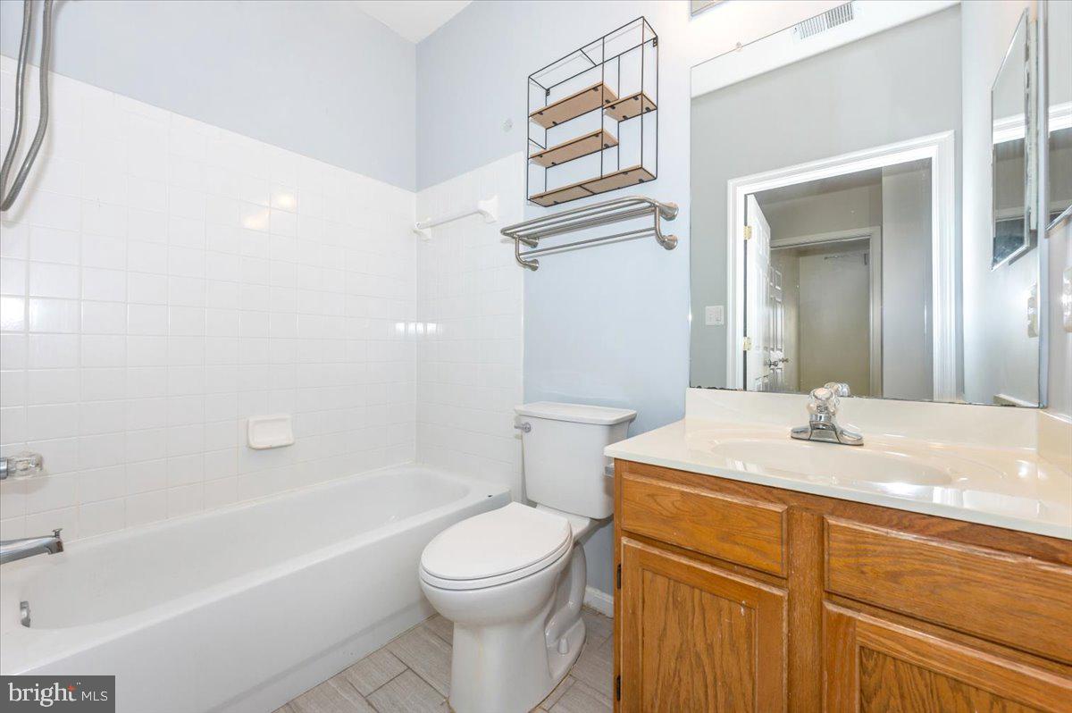 1683 Fallowfield Court Crofton, MD 21114 - Photo 22 of 28 a bathroom with a sink a toilet and shower