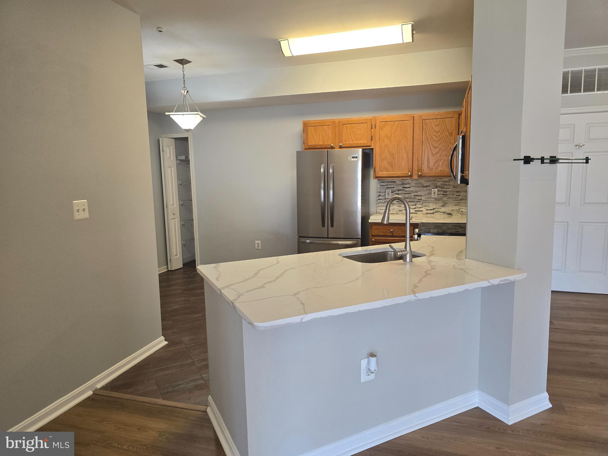 1683 Fallowfield Court Crofton, MD 21114 - Photo 5 of 28 a bathroom with a sink a mirror and a vanity