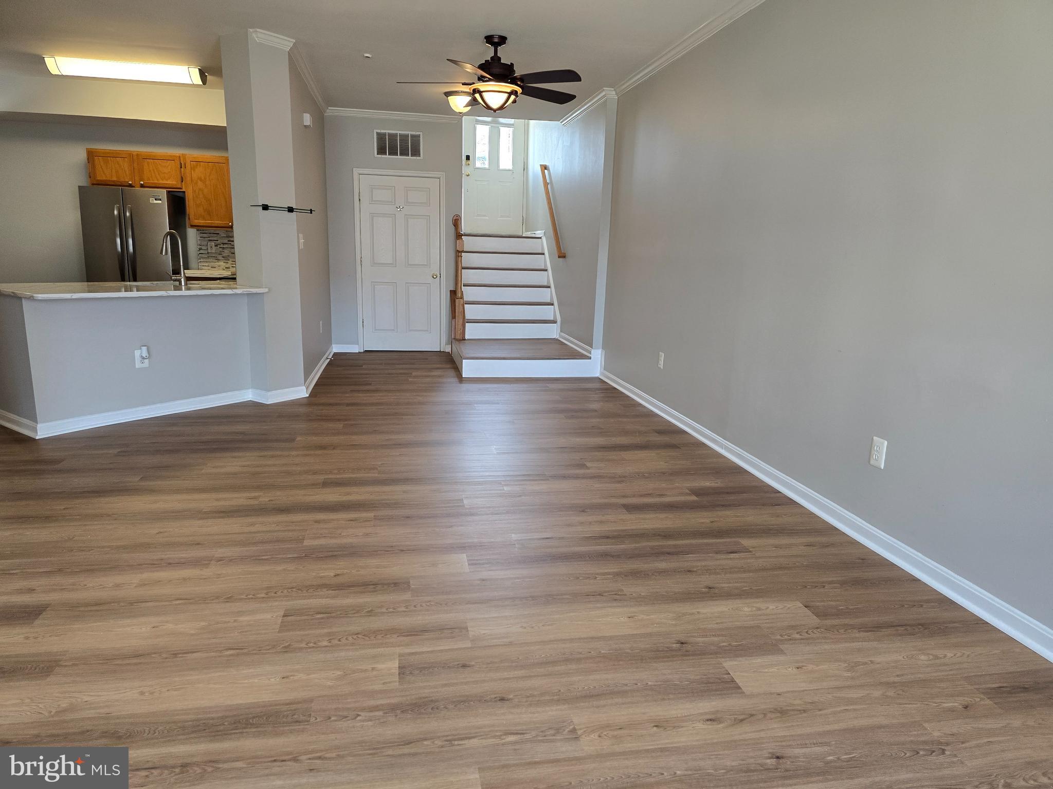 1683 Fallowfield Court Crofton, MD 21114 - Photo 6 of 28 wooden floor in an empty room with a window