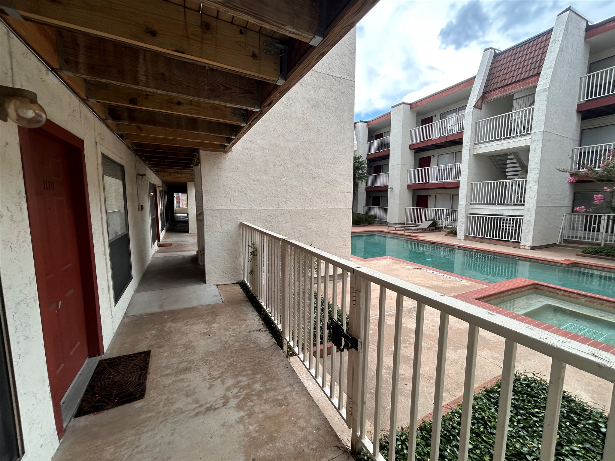 3115 Helms Street, Unit 109 Austin, TX 78705 - Photo 9 of 9 Balcony featuring view of pool area