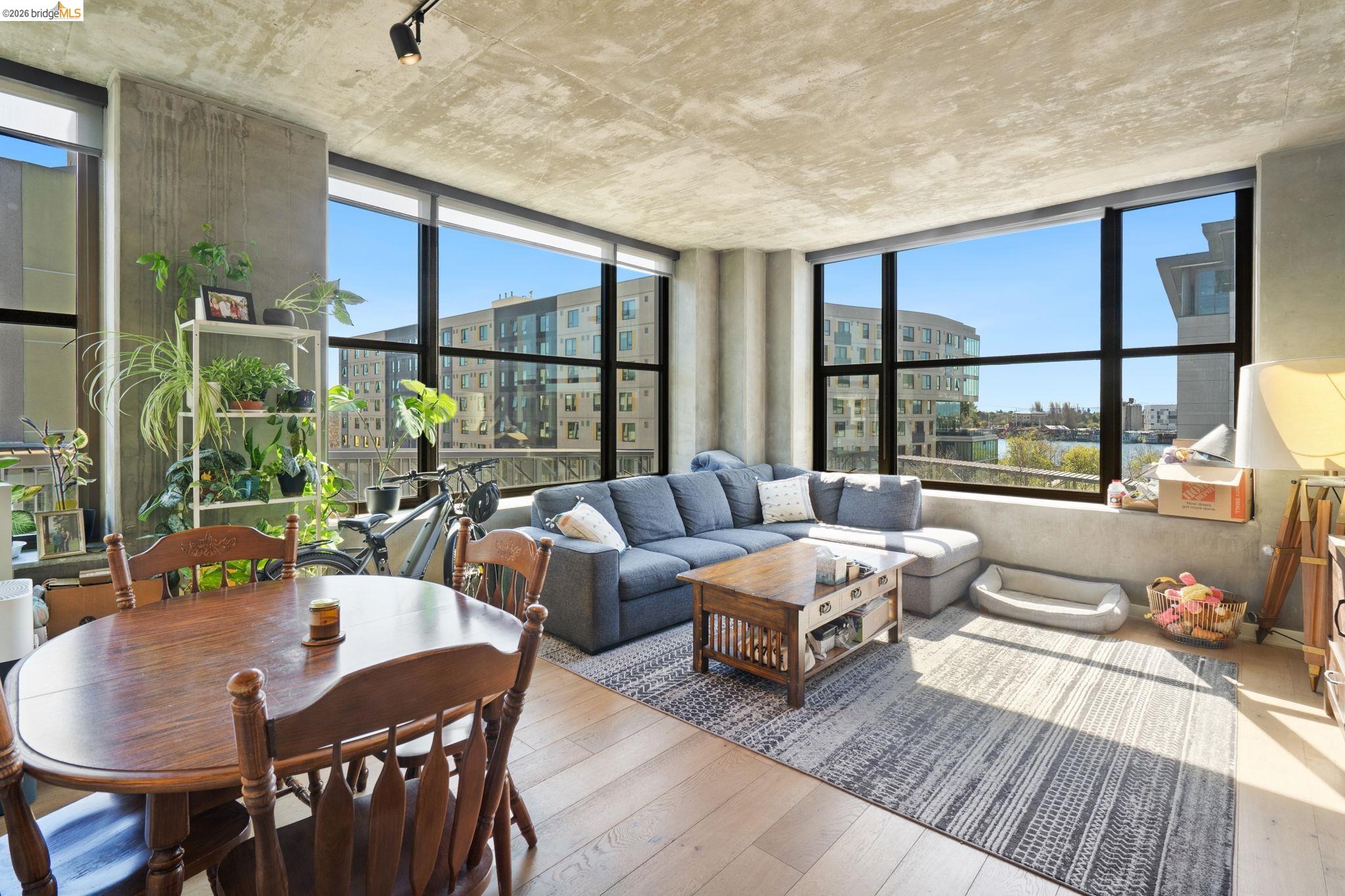 311 2nd Street, Unit 511 Oakland, CA 94607 - Photo 12 of 44 Living area with hardwood / wood-style floors, a view of city, and track lighting