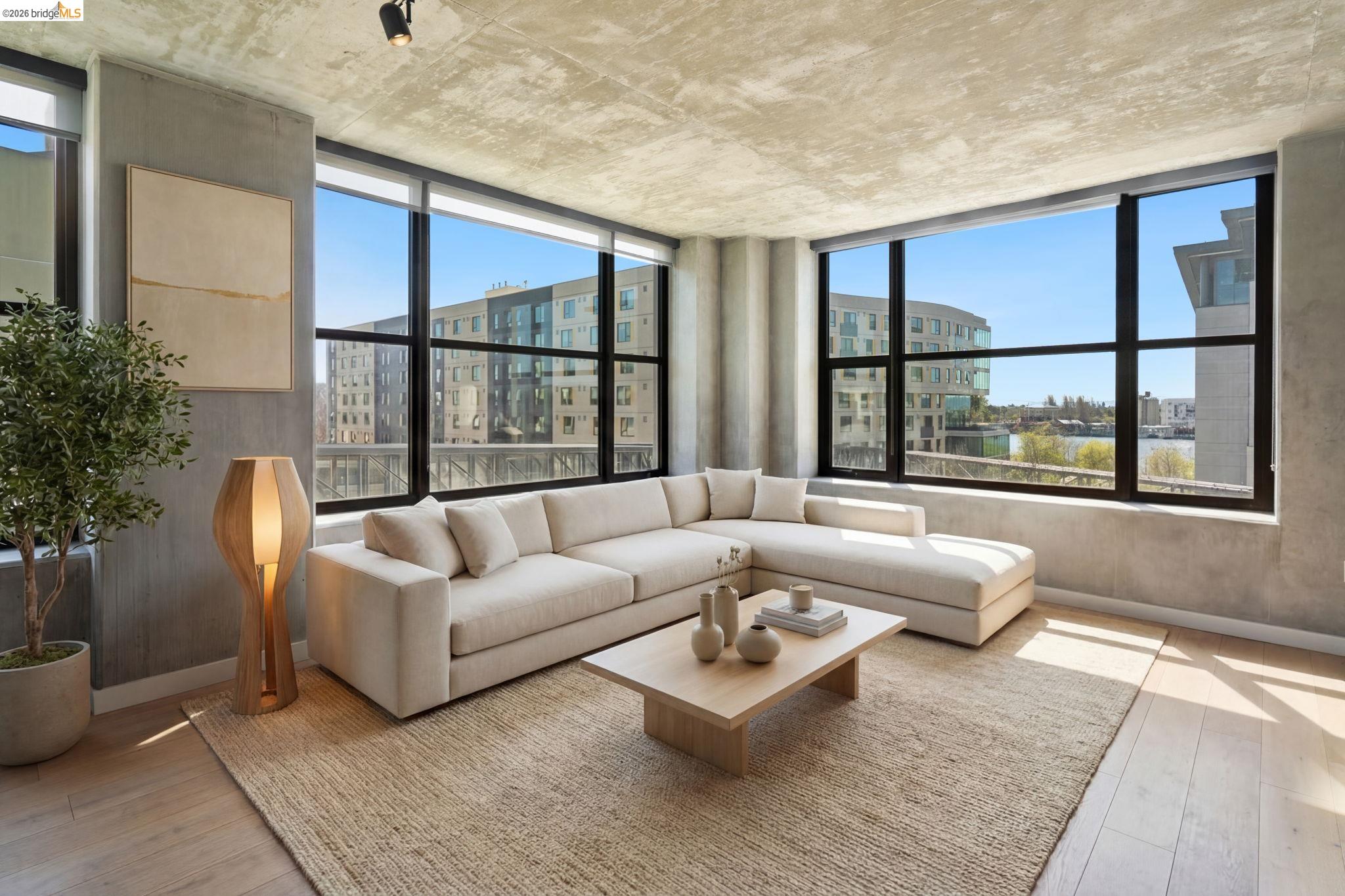 311 2nd Street, Unit 511 Oakland, CA 94607 - Photo 14 of 44 Living room with light wood finished floors and a city view