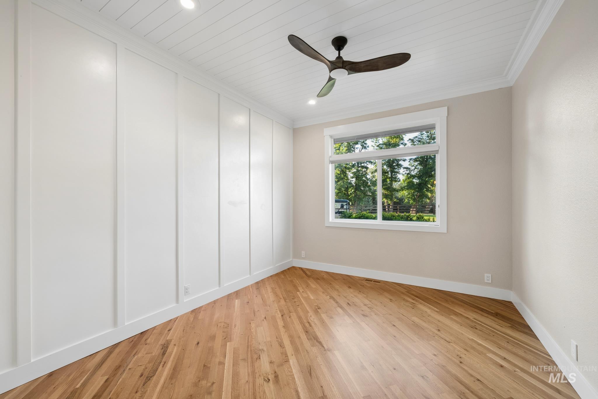 2050 Artesian Road Eagle, ID 83616 - Photo 40 of 49 Room featuring wood-finish flooring, a contemporary ceiling fan, recessed lighting, and a window offering abundant natural light and exterior views