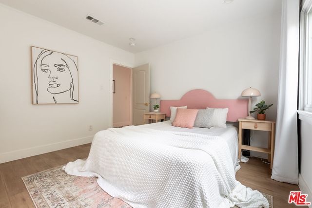 a bedroom with a bed and a table in it