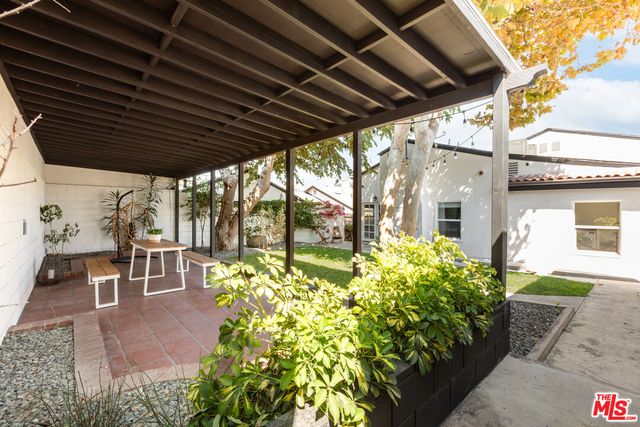 a view of living room with furniture and white walls