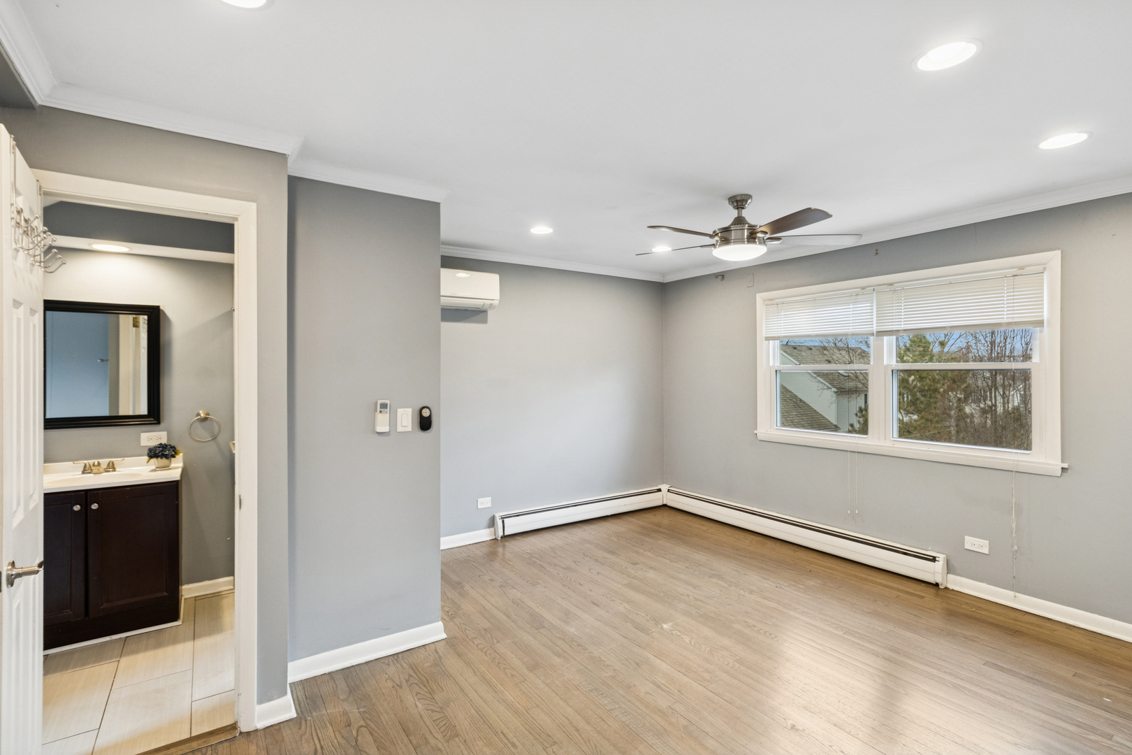 902 East Main Street Barrington, IL 60010 - Photo 11 of 33 a view of an empty room with window and wooden floor