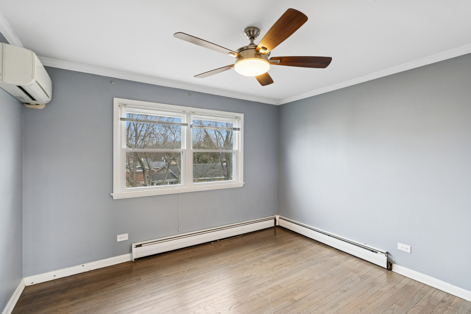 902 East Main Street Barrington, IL 60010 - Photo 17 of 33 an empty room with wooden floor and windows