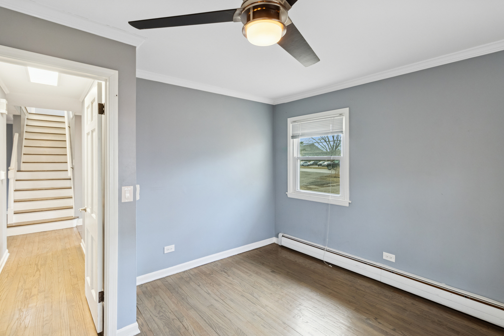 902 East Main Street Barrington, IL 60010 - Photo 8 of 33 a view of empty room with wooden floor and fan
