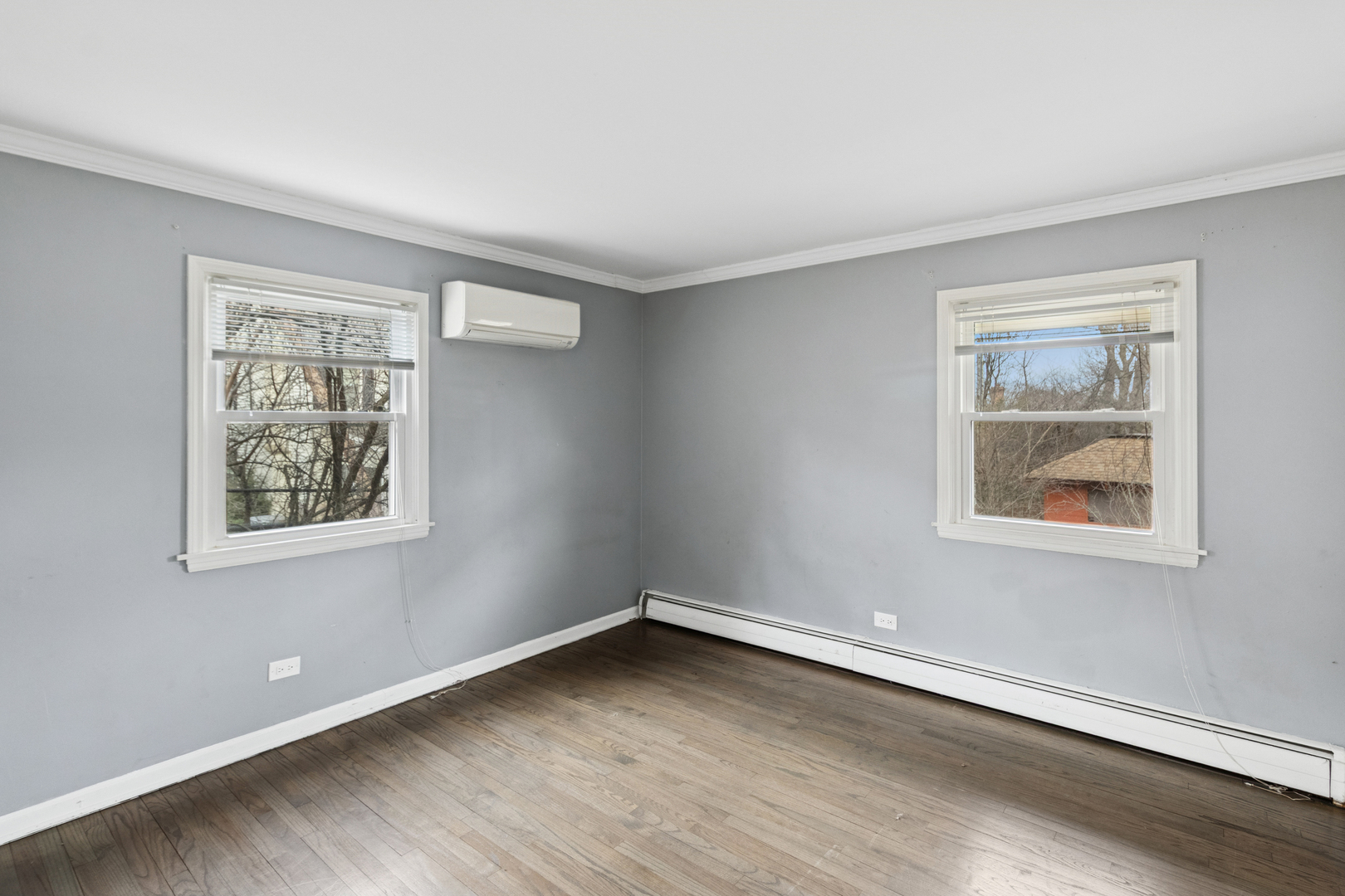 902 East Main Street Barrington, IL 60010 - Photo 10 of 33 a view of an empty room with wooden floor and a window