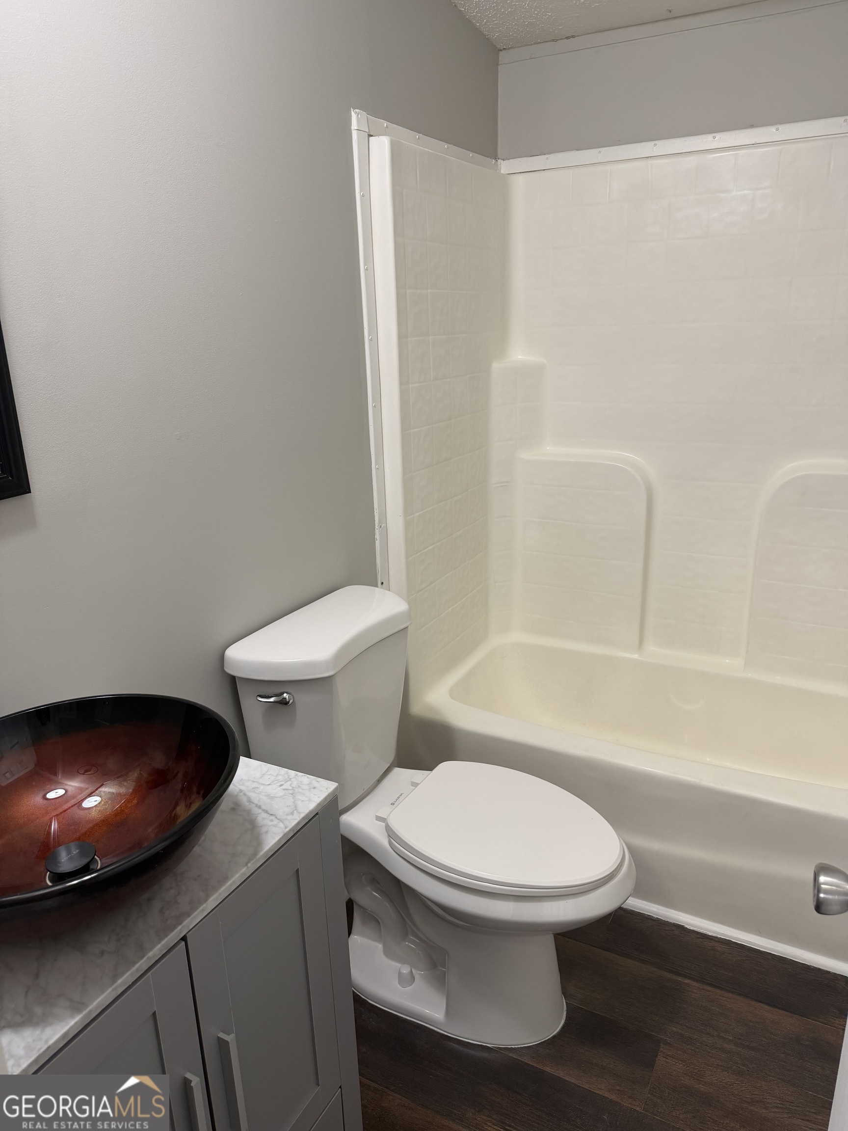 405 Windsor Parkway, Unit 405W Hampton, GA 30228 - Photo 15 of 16 a white toilet and a sink