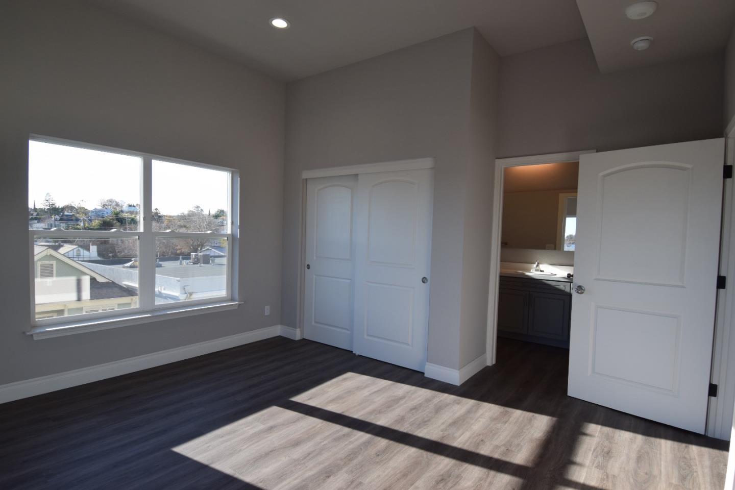 93 South 2nd Street Rio Vista, CA 94571 - Photo 11 of 25 a view of an empty room and window and wooden floor